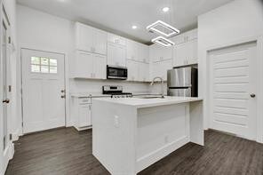 Stainless steel appliances, refrigerator included.
