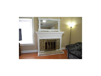 Beautiful fireplace with tile.