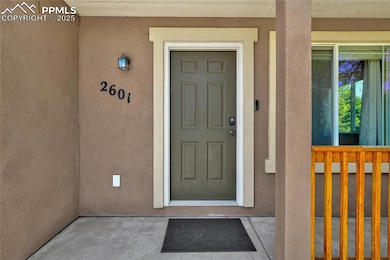 View of exterior entry with stucco siding