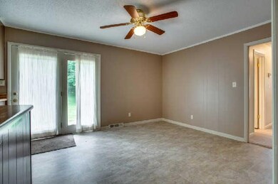 12x12 dining has room for a large table, hutch and more, French doors exit to patio