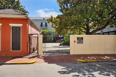 Front parking lot with electric front gate. Street