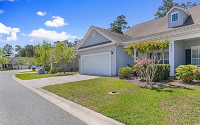 View of side of property with an attached garage, 
