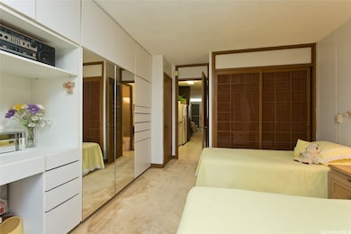 Bedroom with built in dressers, storage, and close