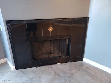 Living room has a decorative Black Marble Fireplac
