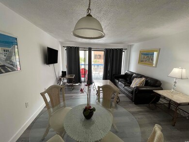 Dining area featuring a textured ceiling