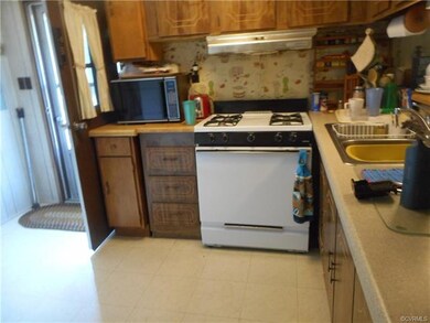 Kitchen area showing gas stove.