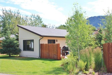 View of home with deck