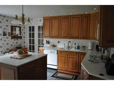 Kitchen. Corian countertops, integrated sink and H