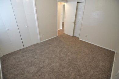 Unfurnished bedroom featuring carpet floors and b