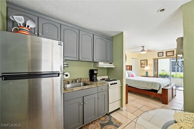 Kitchen with freestanding refrigerator, electric r