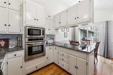 Kitchen featuring tasteful backsplash, appliances 