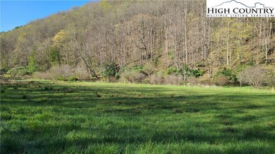 Flat acre on the River plus 22 more across the roa