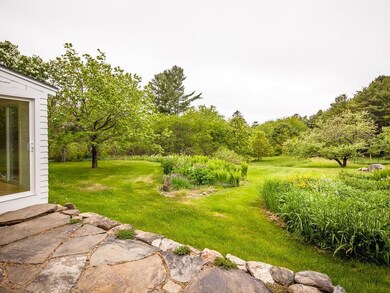 Iris, Lilies, and Lupines abloom in...