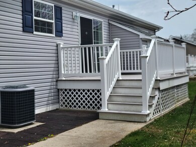 Rear deck off dining room. Also brick patio to rea