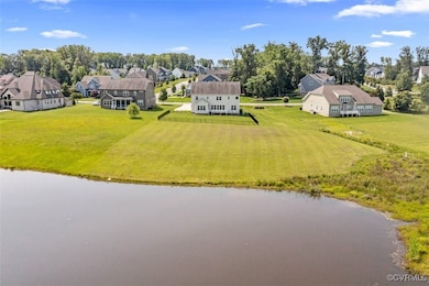 Aerial view of residential area with a large body