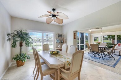 Dining area with light tile patterned flooring and ceiling fan
