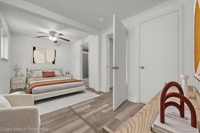 Bedroom featuring light wood-style floors and a ceiling fan