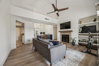 Living room featuring wood finished floors, basebo