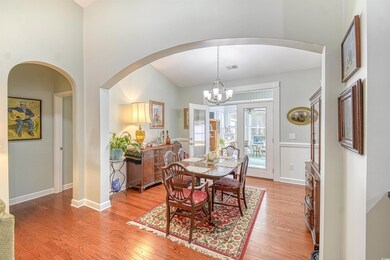 Dining space featuring a chandelier and light hard