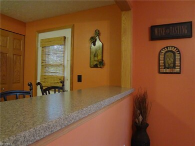 The open kitchen breakfast bar is ready for tall s