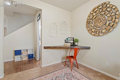 Office with carpet floors and baseboards