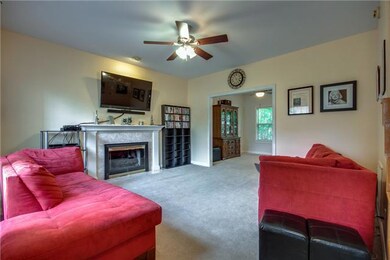 Nice living room with fireplace and ceiling fan