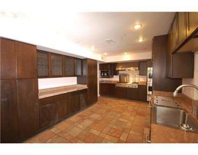 Kitchen. Ceramic tile floor, lots of lighting, gla