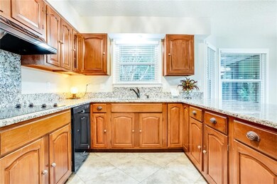 Lots of oak cabinets, cooktop, double oven, dishwa