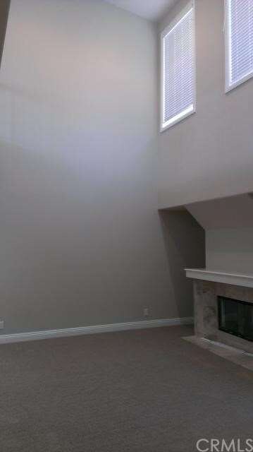 Living Room with 2 story ceiling and fireplace