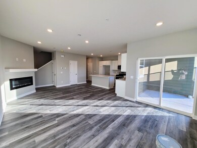 Fairfax view towards kitchen and family room from dining room. Photo is of actual home.