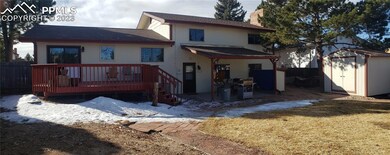 Large fenced in backyard with covered patio