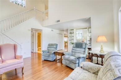 Vaulted ceilings in the living room make for an ai