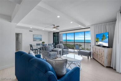 Living room with beamed ceiling, recessed lighting