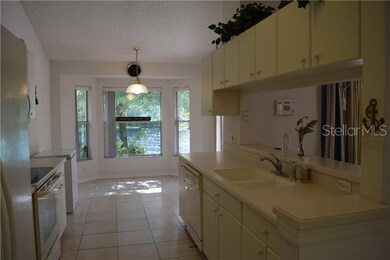 Lovely Corian countertops, light colored cabinetry