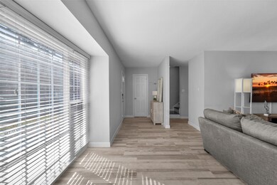 Beautiful, new laminate flooring flows throughout