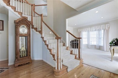 Guests will enter into a bright foyer with winding