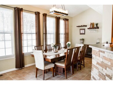 Gorgeous morning room with vaulted ceilings and lo