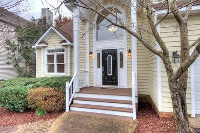 Inviting front porch with aggregate walk and beaut