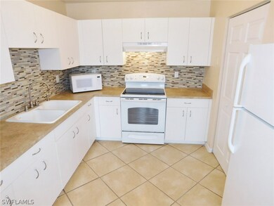 Kitchen With New Countertops, Tile Backspash, and