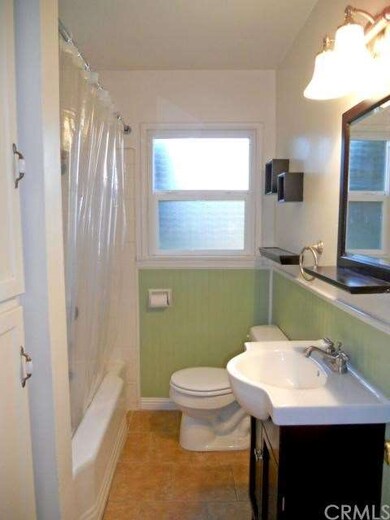 Updated bathroom with tile floor, newer vanity, wa