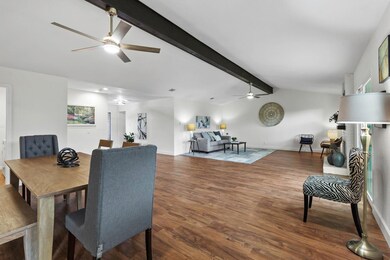 Dining room with ceiling fan, wood finished floor