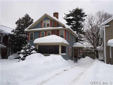 Exterior Front. A classic side entry Colonial.
