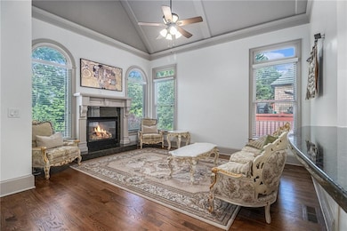 Living area featuring vaulted ceiling, a high end 