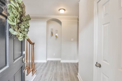 Beautiful entry with updated flooring and newly painted walls.