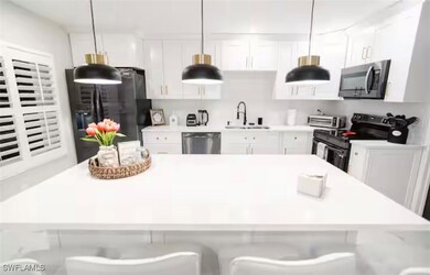 Kitchen featuring appliances with stainless steel