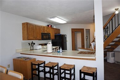 To the back is the mud room entry door with a side