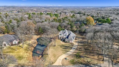 Dramatically nestled on one acre, this property offers quiet living outside the city limits, yet with easy access to medical, shopping and major highways.