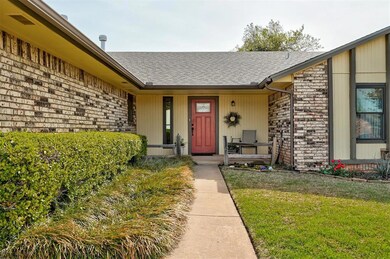 Welcoming property entrance with a shingled roof, 