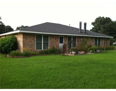 Exterior Back. Concrete patio area for your cookou