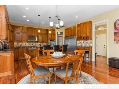 Large kitchen with center island and informal eati